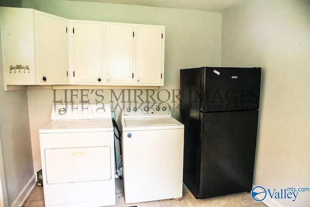 525 Quincy St, Scottsboro, AL 35768 - laundry room featuring cabinet space and washer and dryer