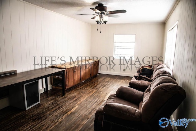 525 Quincy St, Scottsboro, AL 35768 - living area with crown molding, ceiling fan, dark wood-style floors, healthy amount of natural light, and baseboards