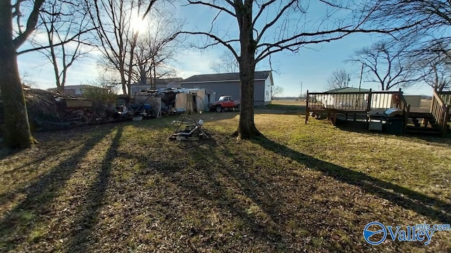 view of yard featuring a wooden deck