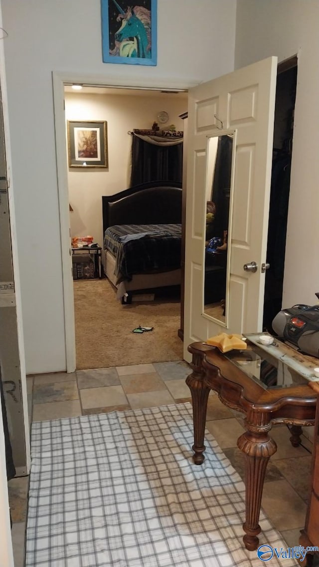 bedroom featuring light colored carpet