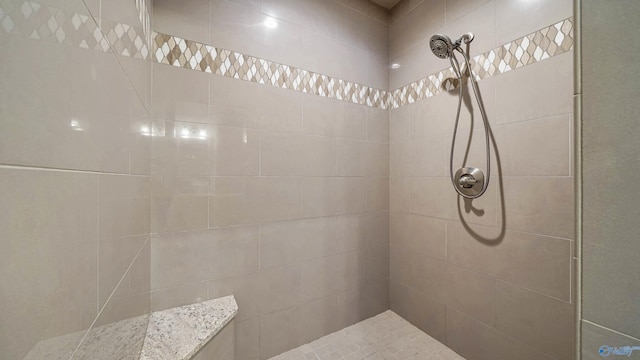 bathroom featuring tiled shower