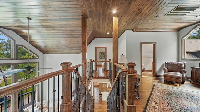 hallway featuring plenty of natural light, wood ceiling, wood-type flooring, and high vaulted ceiling