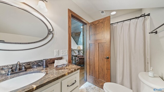 bathroom with vanity, toilet, and tile patterned flooring