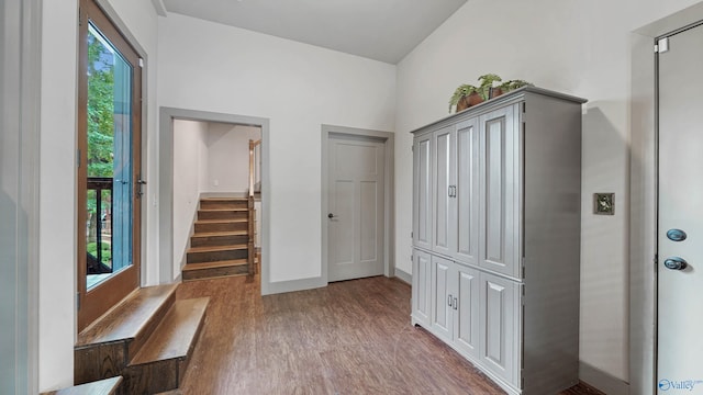 interior space with lofted ceiling and hardwood / wood-style floors