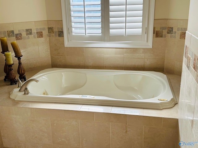 bathroom with tiled bath