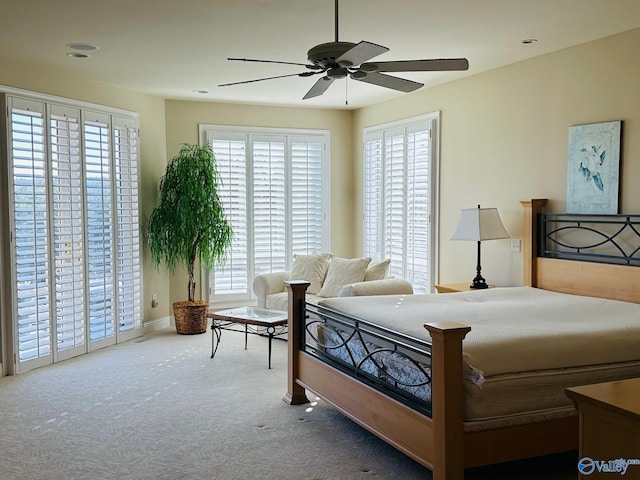 bedroom with ceiling fan, carpet floors, and access to outside