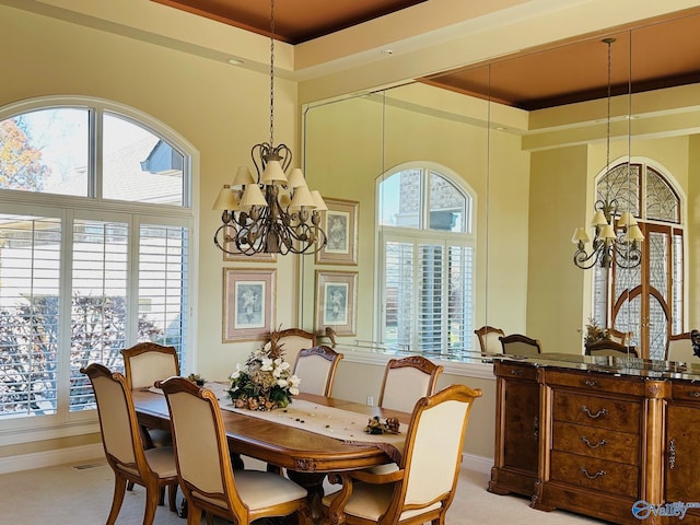 dining area featuring a wealth of natural light and a chandelier