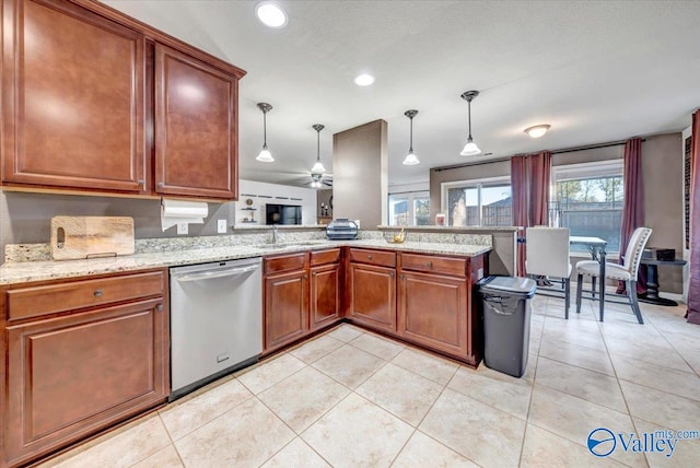 kitchen with kitchen peninsula, light tile patterned floors, stainless steel dishwasher, and hanging light fixtures