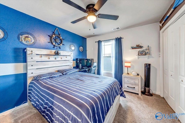 bedroom with carpet, a closet, and ceiling fan