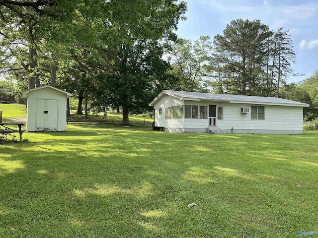 35 County Road 568, Leesburg, AL 35983 - view of grassy yard with a sunroom and a wall mounted air conditioner