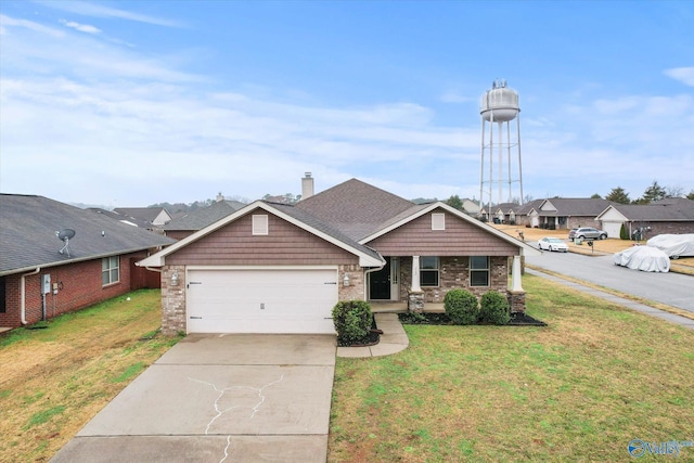 view of front of house with a garage and a front lawn