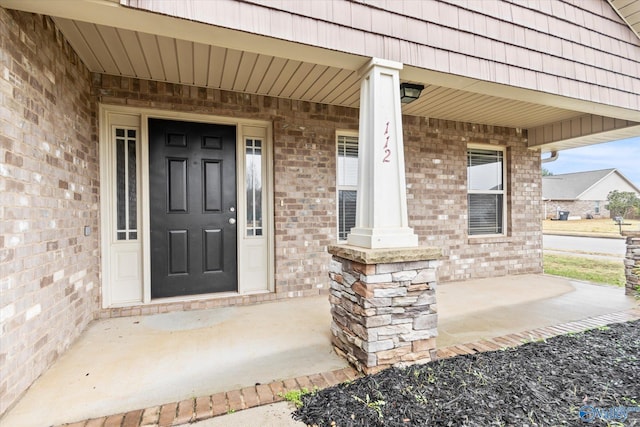 doorway to property with covered porch