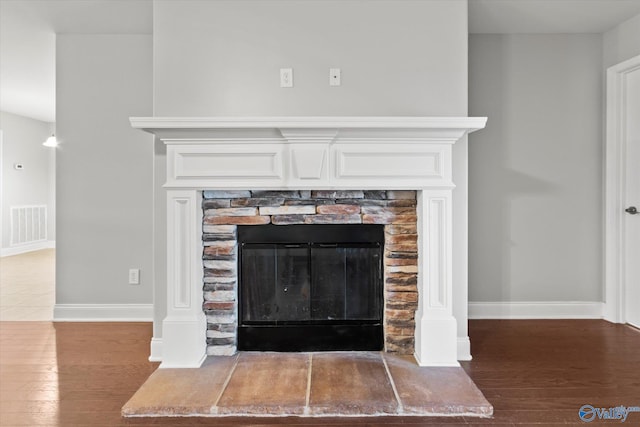 details with hardwood / wood-style floors and a fireplace