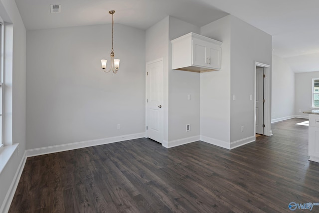 15354 Springbrook Trce, Athens, AL 35611 - interior space featuring a chandelier, vaulted ceiling, dark wood-style floors, and visible vents