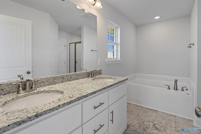 15354 Springbrook Trce, Athens, AL 35611 - bathroom with a sink, a shower stall, double vanity, and a bath