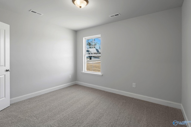 15354 Springbrook Trce, Athens, AL 35611 - spare room featuring visible vents, baseboards, and carpet flooring