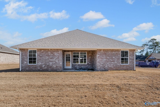 15354 Springbrook Trce, Athens, AL 35611 - back of house featuring brick siding, a shingled roof, and a lawn