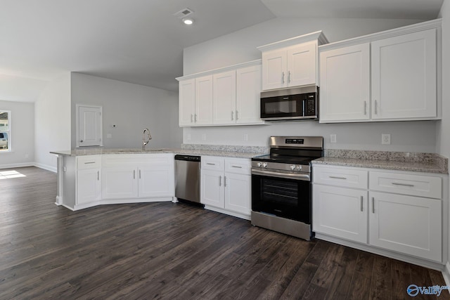 15354 Springbrook Trce, Athens, AL 35611 - kitchen featuring a peninsula, visible vents, white cabinets, appliances with stainless steel finishes, and lofted ceiling