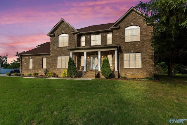 123 Coyote Creek Rd, Meridianville, AL 35759 - view of front of house featuring brick siding and a lawn