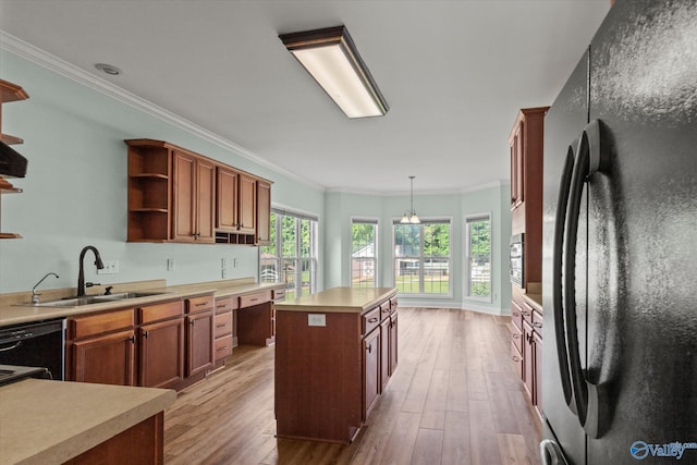 123 Coyote Creek Rd, Meridianville, AL 35759 - kitchen with black appliances, a sink, open shelves, a center island, and ornamental molding