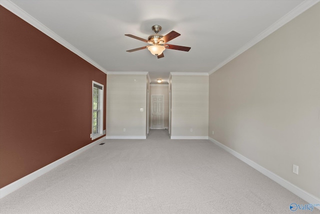 123 Coyote Creek Rd, Meridianville, AL 35759 - empty room with a ceiling fan, ornamental molding, baseboards, and light carpet