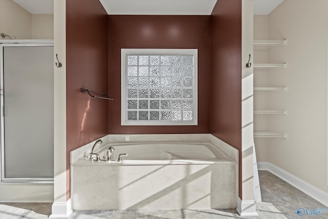 123 Coyote Creek Rd, Meridianville, AL 35759 - full bathroom featuring a stall shower and a bath