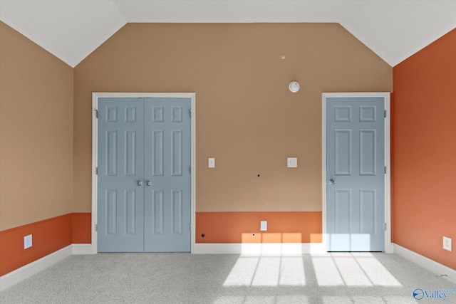 123 Coyote Creek Rd, Meridianville, AL 35759 - spare room with vaulted ceiling, carpet floors, and baseboards