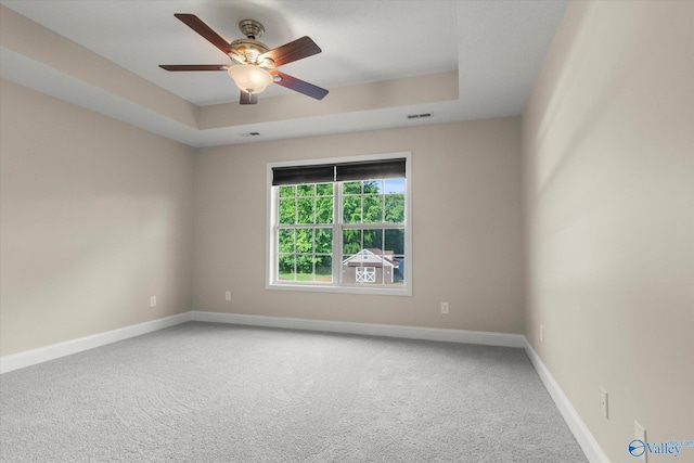 123 Coyote Creek Rd, Meridianville, AL 35759 - carpeted empty room with a ceiling fan, baseboards, and a raised ceiling