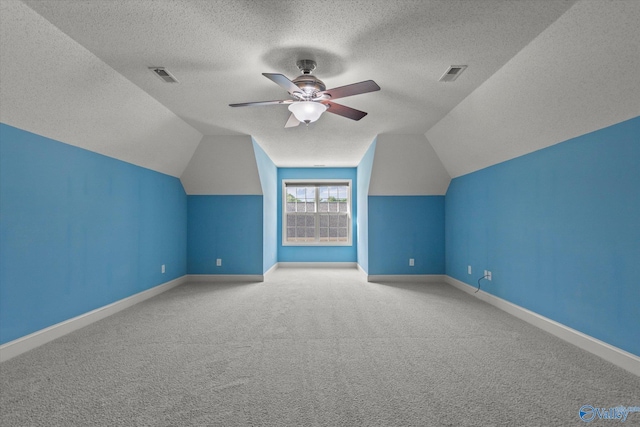 123 Coyote Creek Rd, Meridianville, AL 35759 - bonus room with a textured ceiling, carpet, vaulted ceiling, baseboards, and ceiling fan