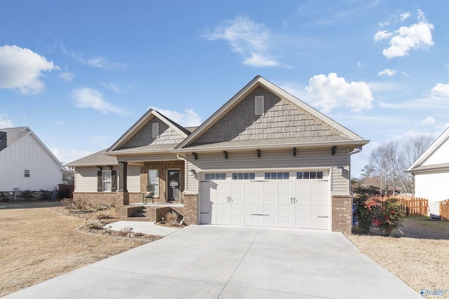 view of front of home with a garage and covered porch