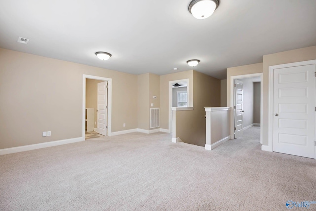 empty room featuring light colored carpet