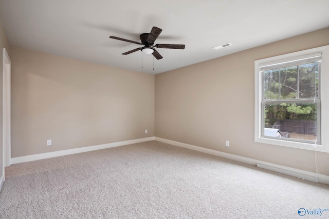 carpeted empty room with ceiling fan