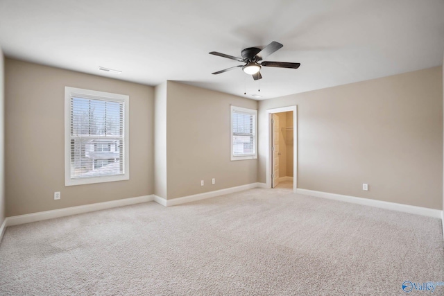 unfurnished room with light carpet and ceiling fan