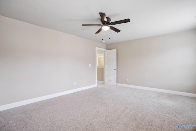 unfurnished room featuring light colored carpet and ceiling fan