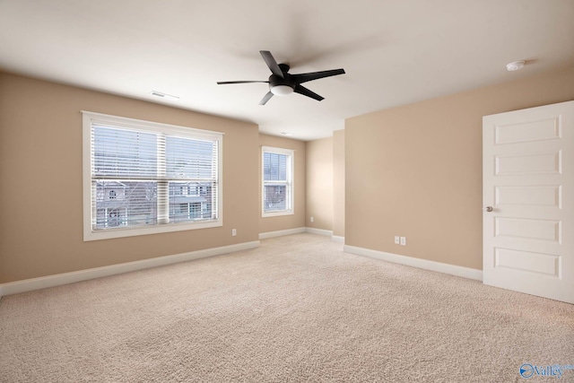 carpeted empty room with ceiling fan