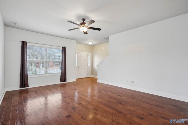 spare room with ceiling fan and dark hardwood / wood-style floors