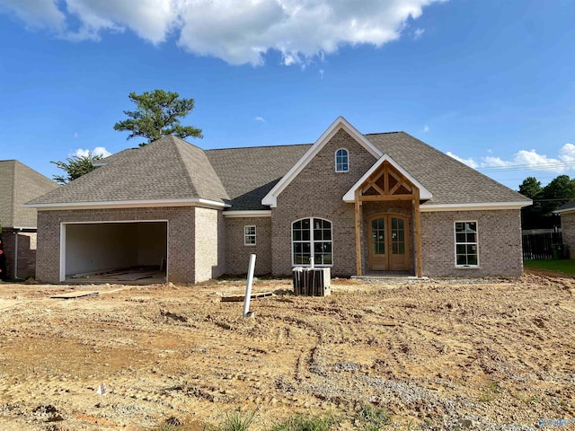 view of front of property with french doors and a garage