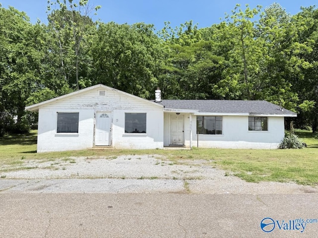 11801 W Gateway Dr SE, Huntsville, AL 35803 - view of front of property with a front lawn and concrete block siding
