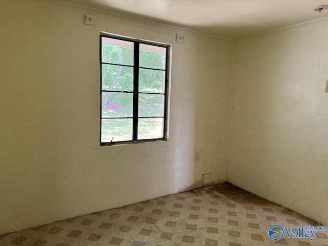 11801 W Gateway Dr SE, Huntsville, AL 35803 - spare room with ornamental molding and concrete block wall