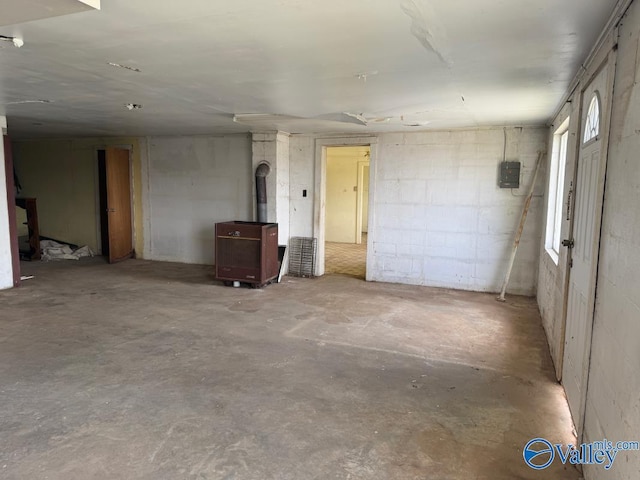11801 W Gateway Dr SE, Huntsville, AL 35803 - basement featuring a wood stove and electric panel
