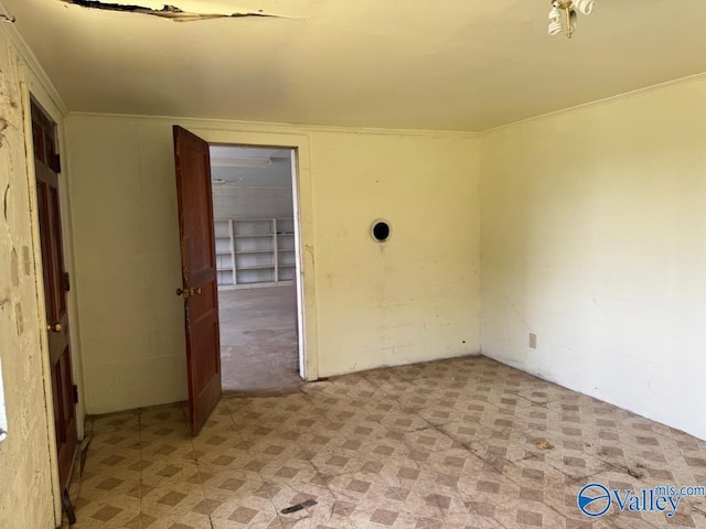 11801 W Gateway Dr SE, Huntsville, AL 35803 - spare room with light flooring and crown molding