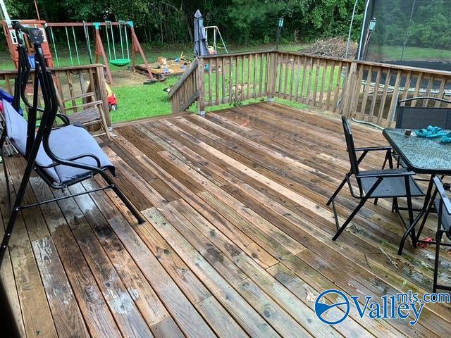 7015 Main St, Gadsden, AL 35903 - wooden deck featuring outdoor dining area