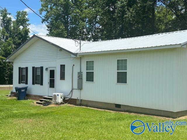 7015 Main St, Gadsden, AL 35903 - rear view of house featuring crawl space, a yard, and a metal roof