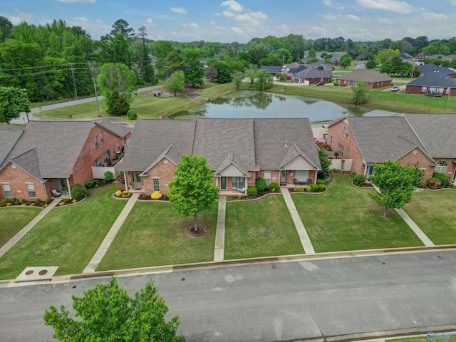 drone / aerial view with a residential view and a water view