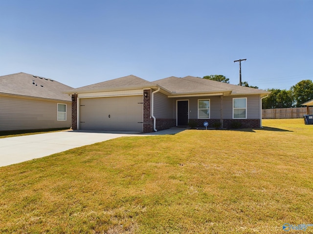 ranch-style house featuring a front lawn and a garage