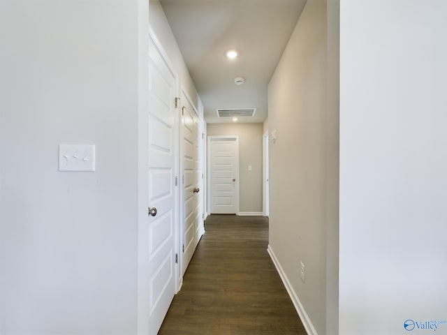 hall featuring dark wood-type flooring