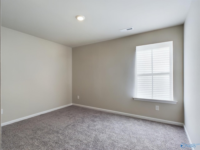 view of carpeted spare room