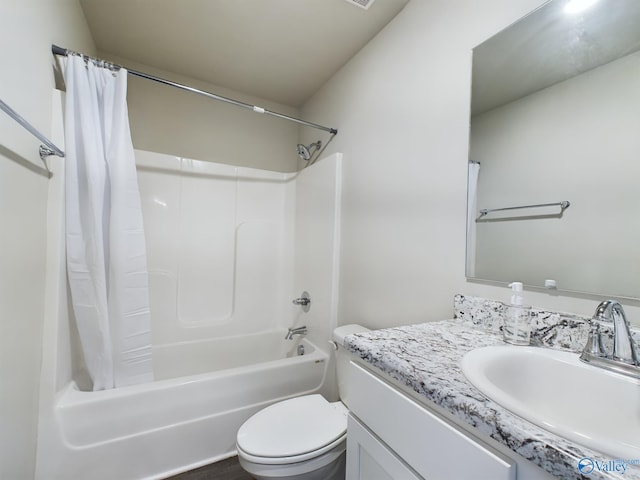 full bathroom with toilet, shower / tub combo, and vanity