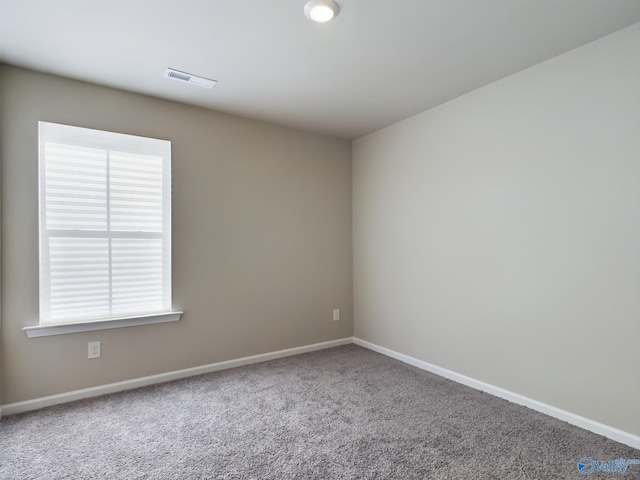 unfurnished room featuring carpet flooring