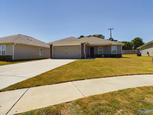 single story home with a garage and a front lawn